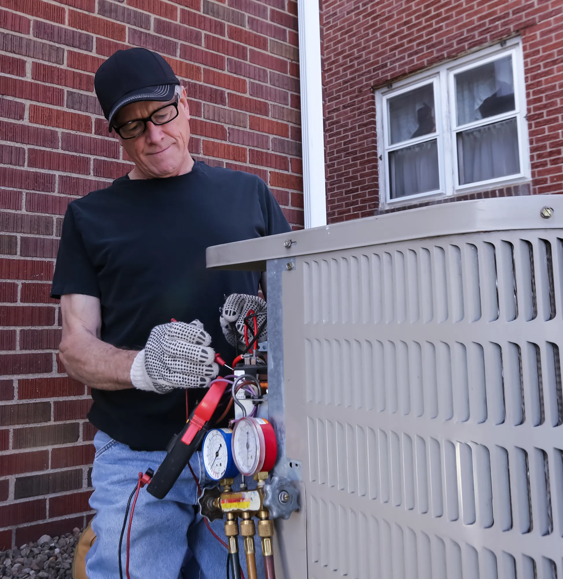 HVAC Technician Repairing Air Conditioning Unit
